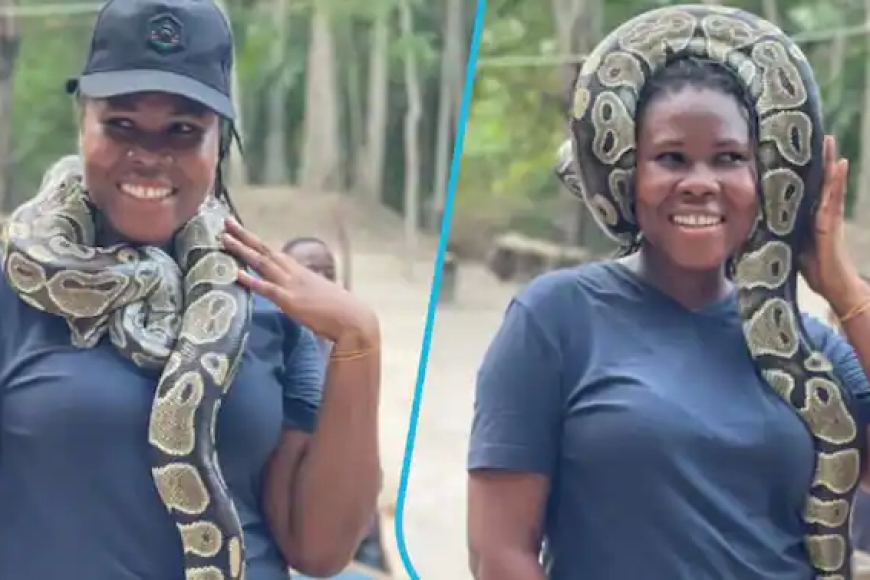 Ntago bisanzwe! Umukobwa wo muri Ghana yatunguranye yambara inzoka mu ijosi avuga ko itamurya