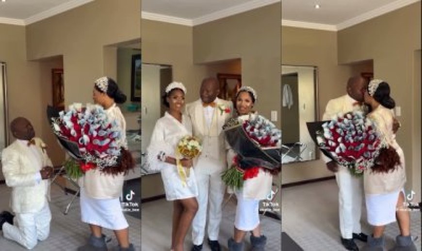 Umugabo ari kubyinira kuru koma yishimye nyuma yaho ahaye indabyo zuzuyemo amafaranga umugore we kubera ko yamwemereye gushaka uwa kabiri[VIDEO]