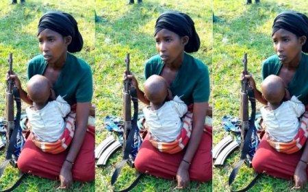 Umugore wo mu mutwe Twirwaneho yagaragaye ari konsa umwana afite n’imbunda mu ntoki [AMAFOTO]